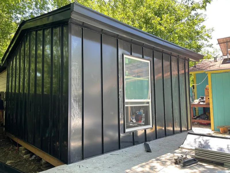 Black standing seam metal wall panels for Roof Inspection in North Madison