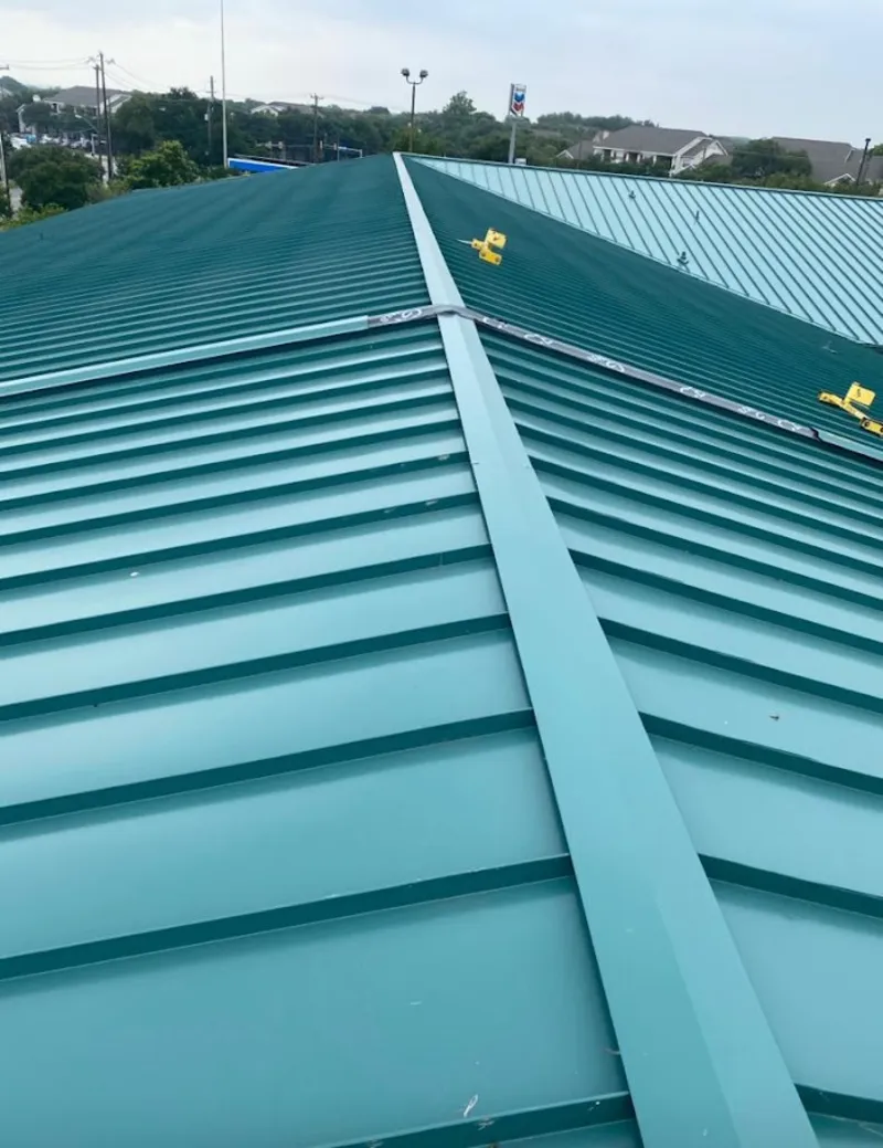 Green commercial metal roof ridge and valley for Metal Roof Repair in North Madison