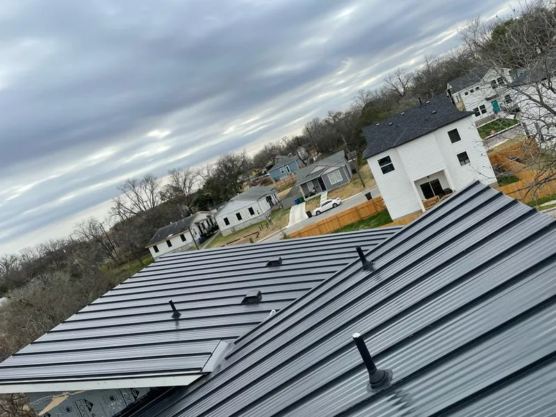Standing seam metal roof panels with vents for Skylight Repair in North Madison